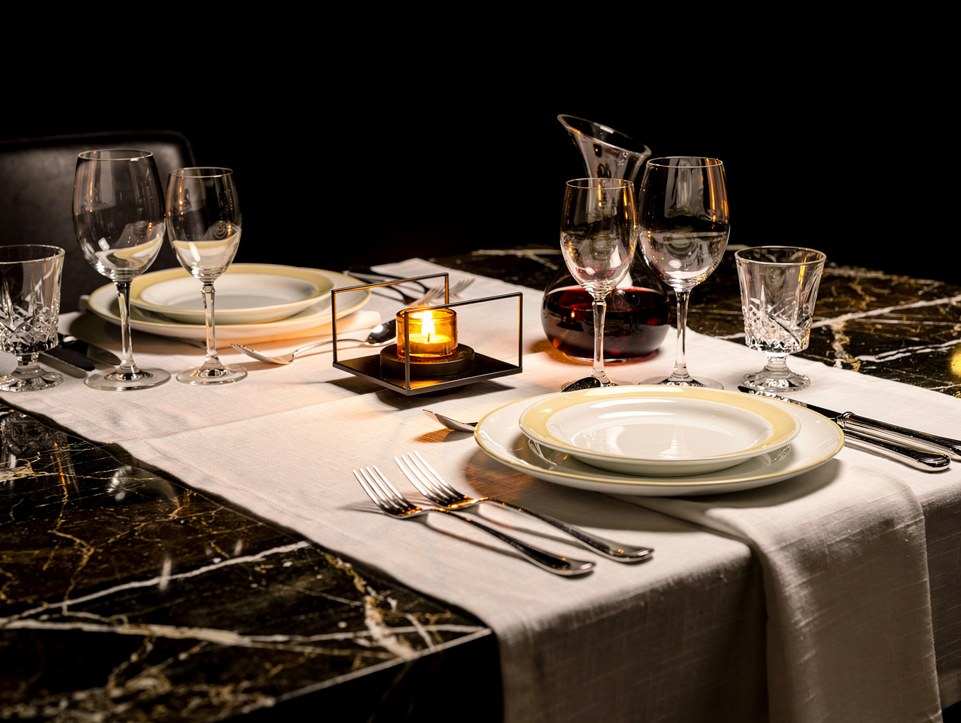 Elegant table setting with fine glassware and candles
